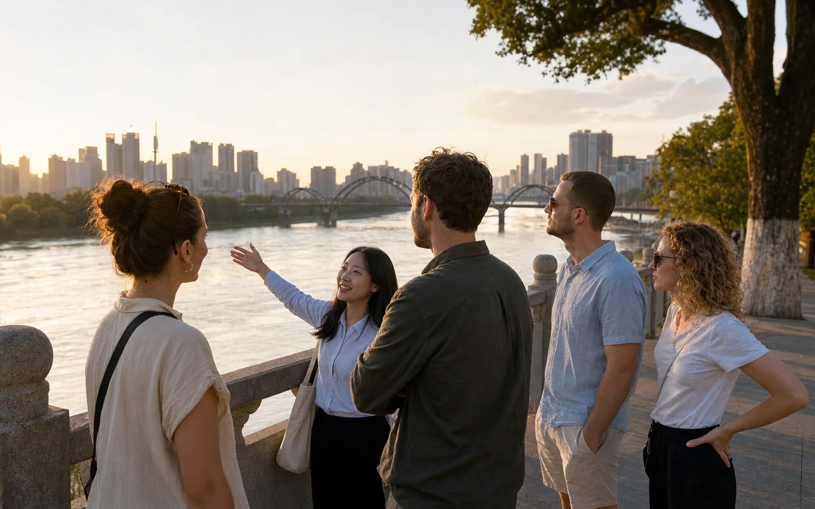 Travelers with a local guide on the Yuan River waterfront in Changde