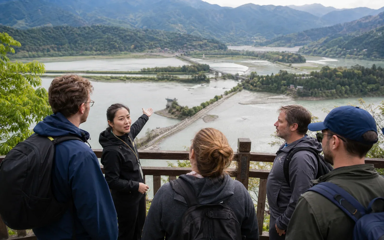 Travelers with a local guide overlooking the Dujiangyan irrigation system