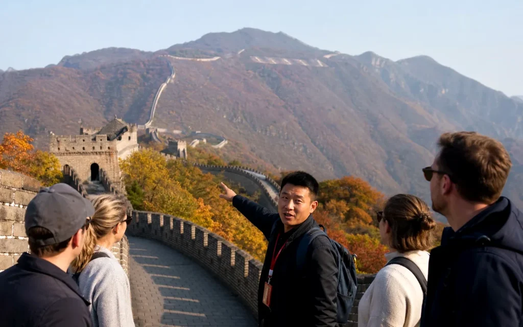 International travelers walking the Great Wall of China with a knowledgeable local guide