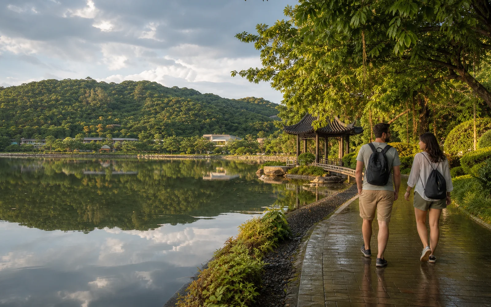 International travelers walking beside Meizi Lake in Puer after a summer rain International travelers walking beside Meizi Lake in Puer after a summer rain