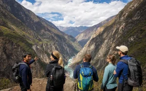 International hikers and a local guide above Tiger Leaping Gorge