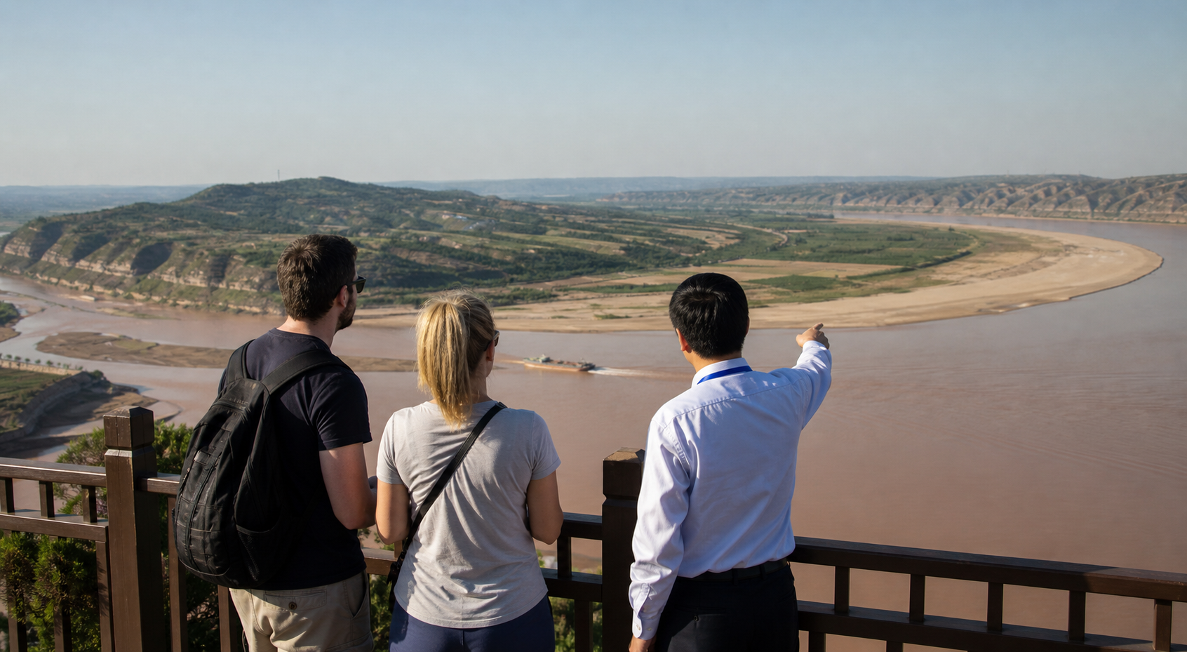 International travelers and a local guide overlooking the Yellow River near Zhengzhou
