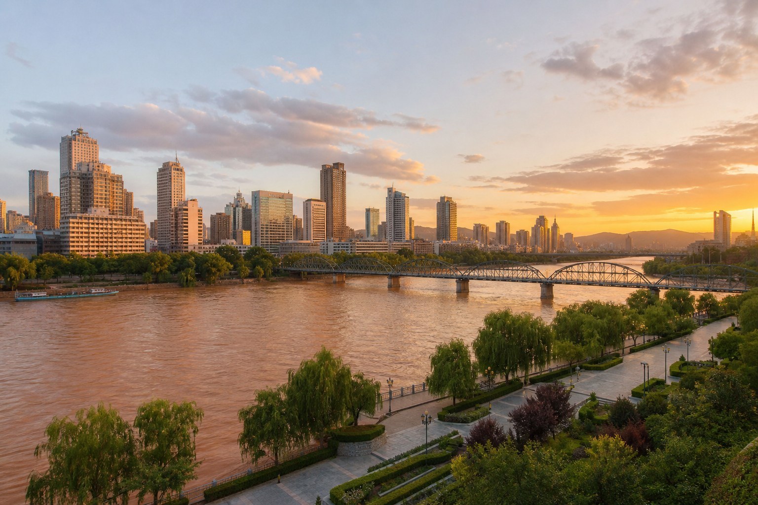 Lanzhou skyline and Yellow River waterfront in warm golden-hour light