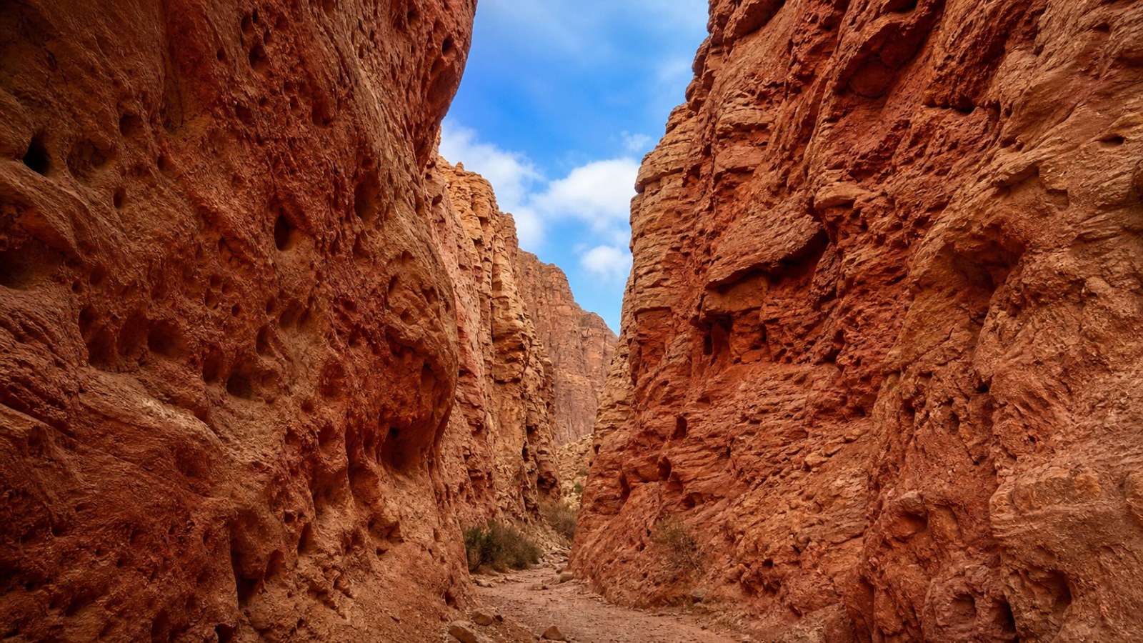 Narrow red-rock trail inside Wensu Grand Canyon