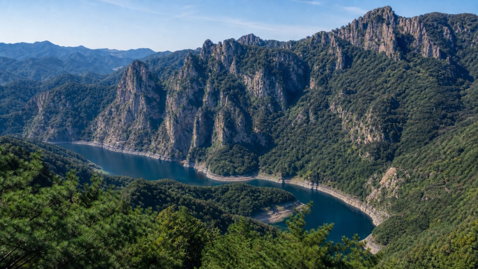 Forested cliffs of Wunv Mountain above the Huanren reservoir