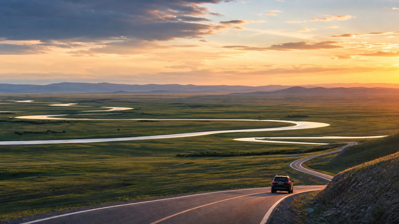 Ribbon River winding across the Hulunbuir grasslands at sunset
