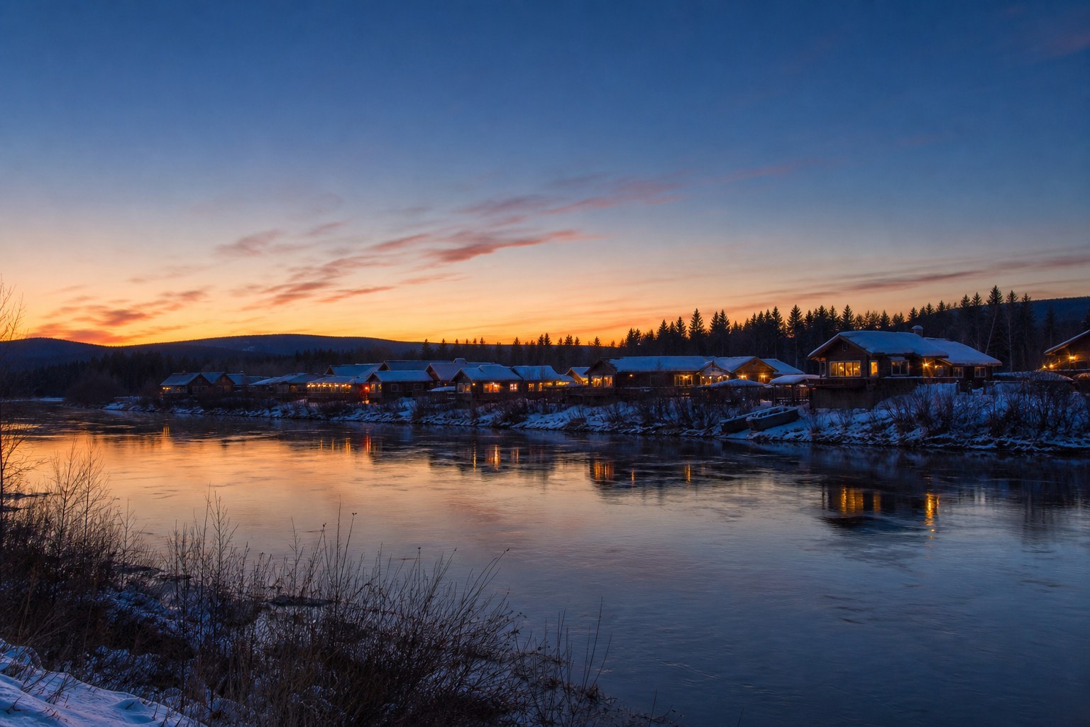 Wooden riverside cabins and luminous northern twilight at Arctic Village near Mohe