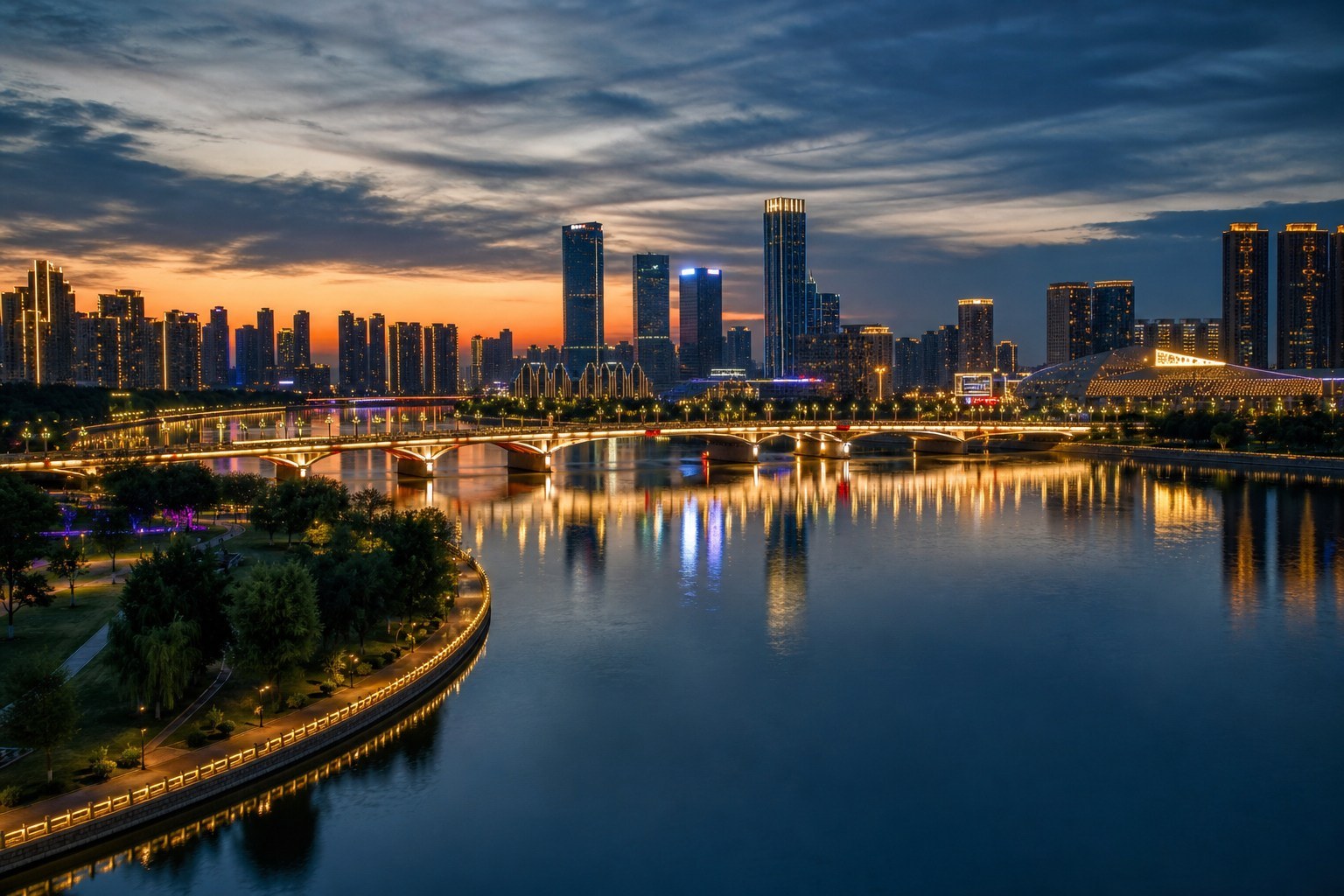 Modern Shenyang skyline reflected in the Hun River at blue hour