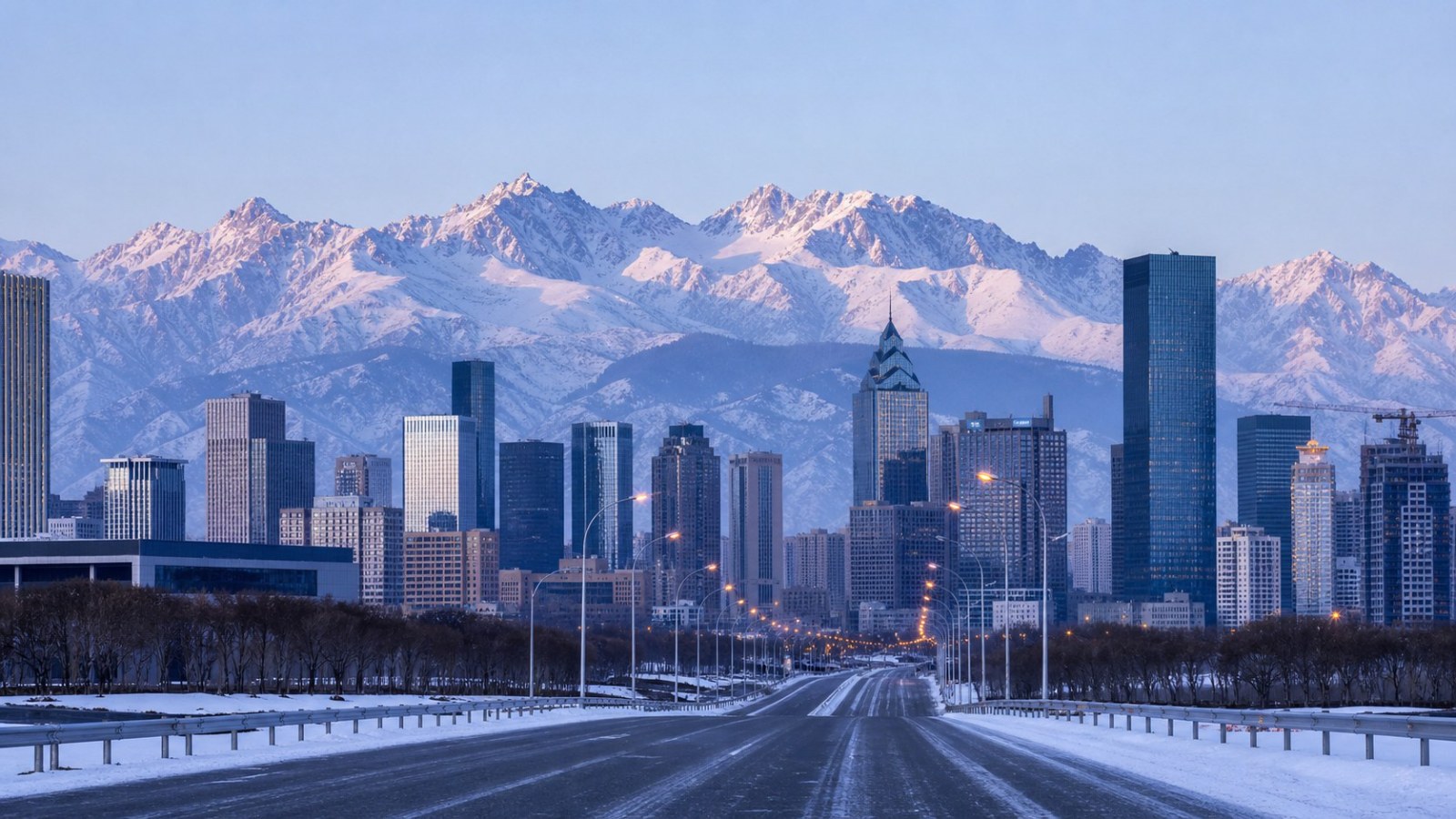 Urumqi winter skyline backed by snow-covered Tianshan Mountains