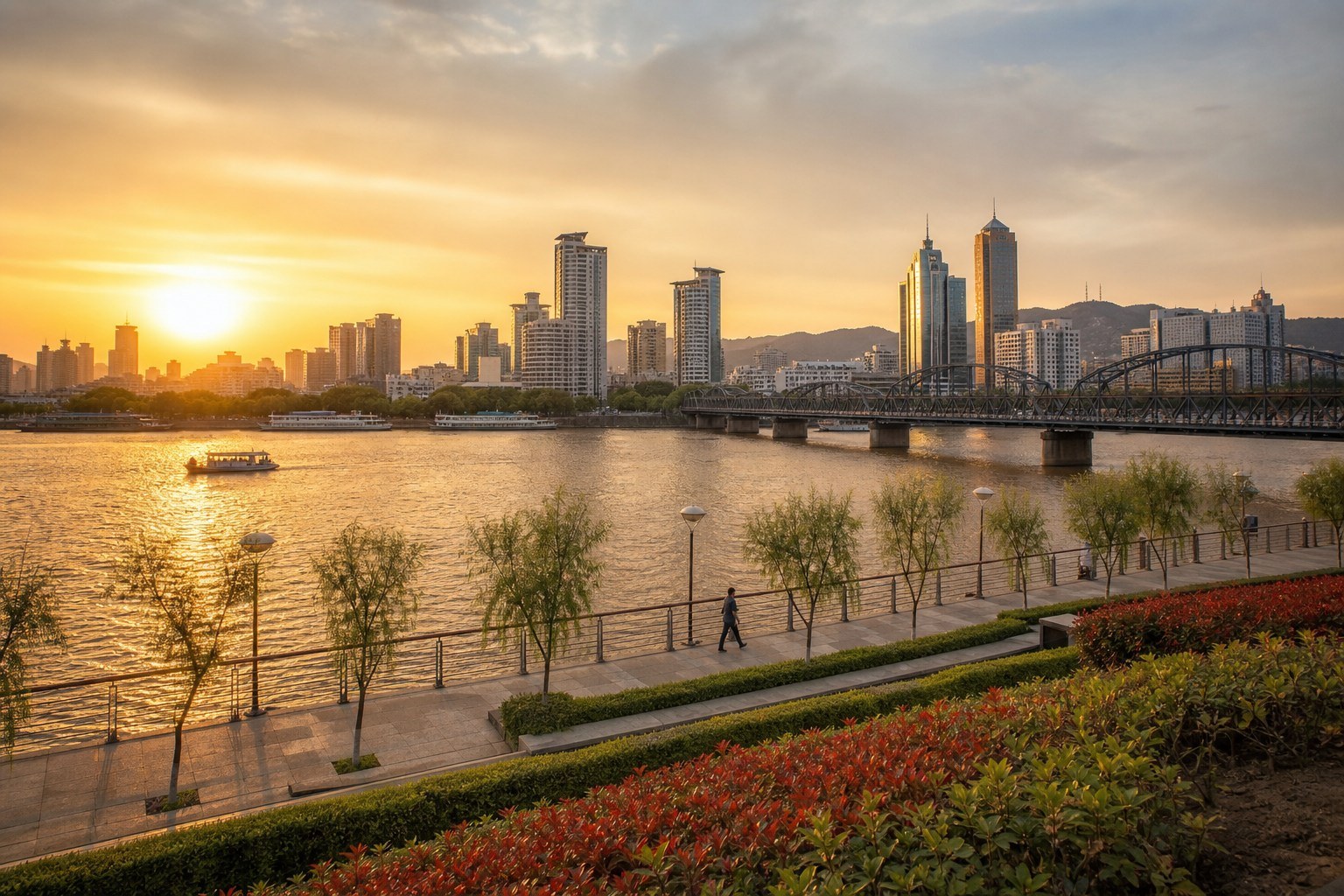 Lanzhou skyline, iron bridge and Yellow River promenade at golden hour