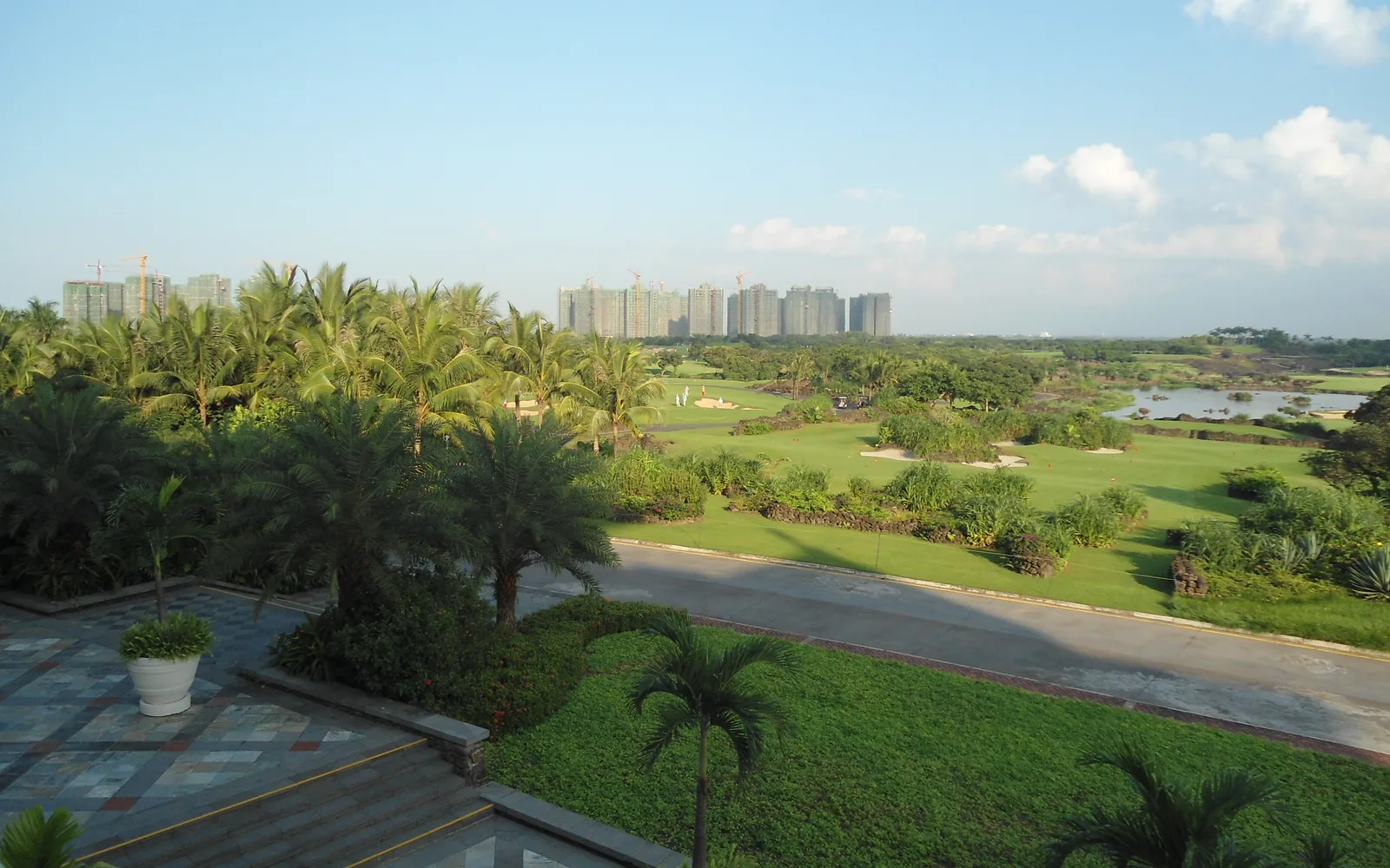 Palm-lined golf course and water features at Mission Hills Haikou in 2012