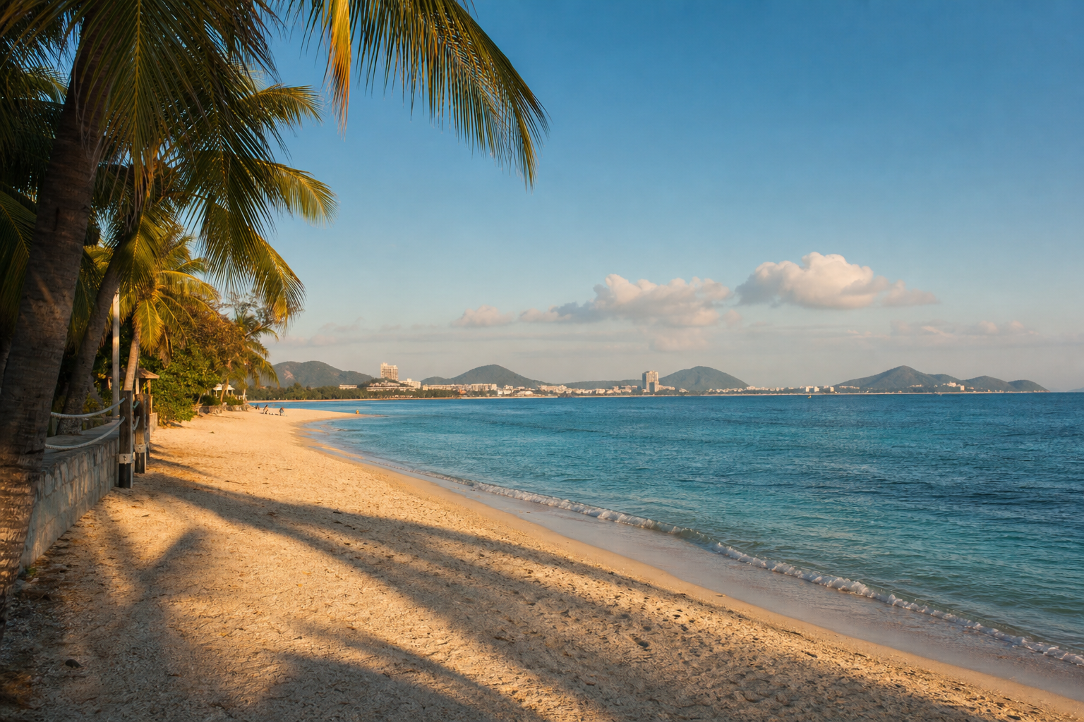 Palm-lined beach and turquoise water in Sanya, Hainan