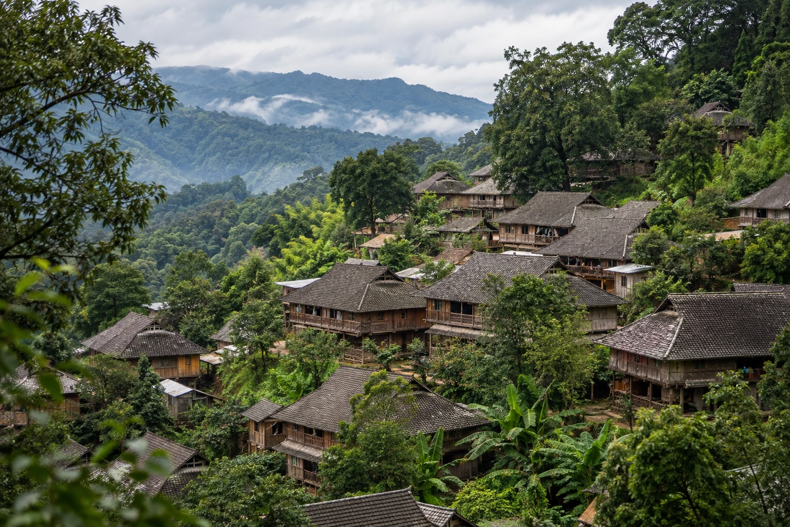 Tiled village roofs among trees in Wengji