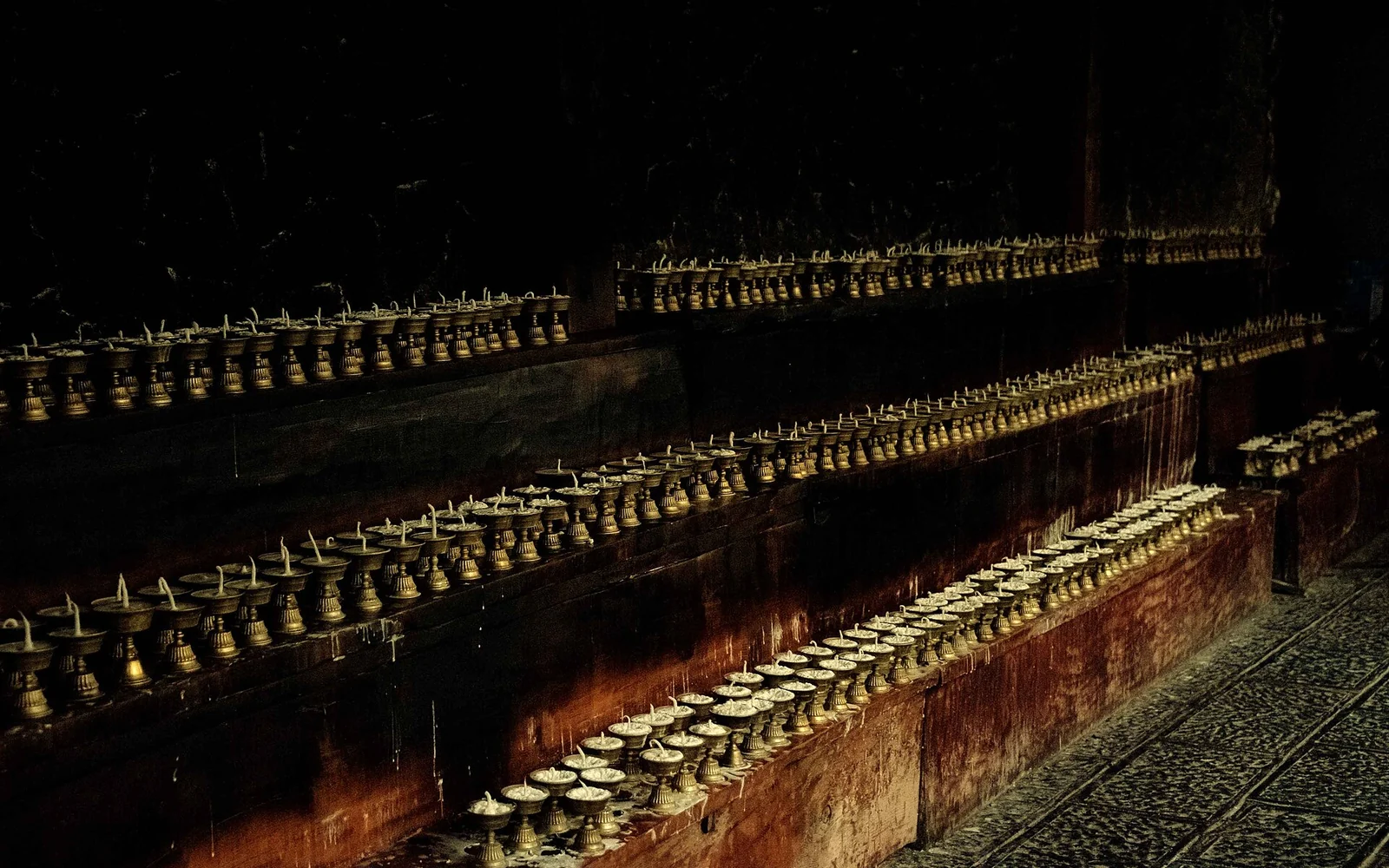 Rows of butter lamps at Songzanlin Monastery