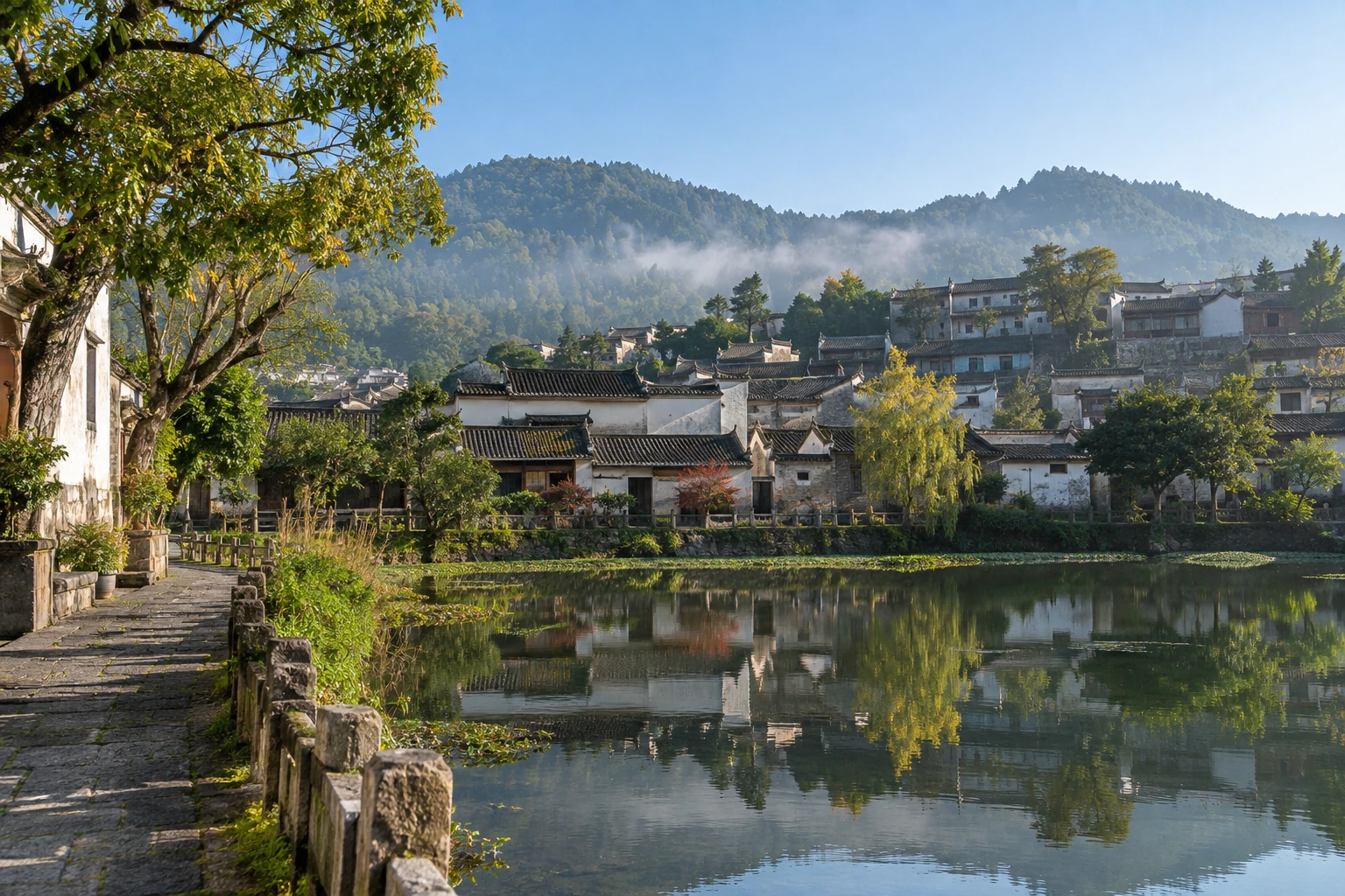 Traditional Heshun houses beside a village pond