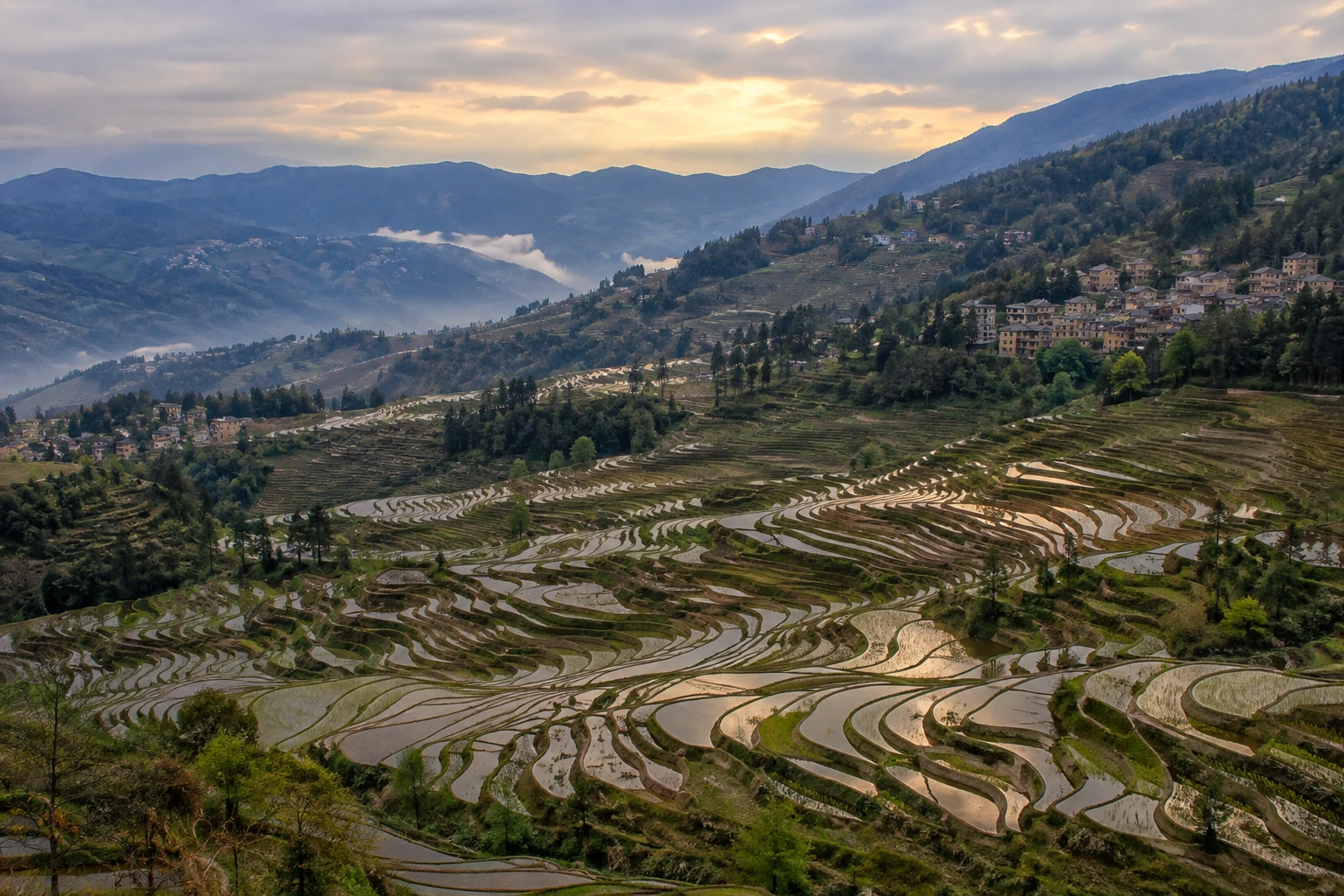 Layered rice terraces across the Bada valley in Yuanyang