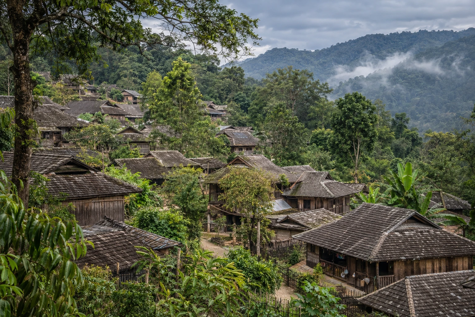 Tiled village roofs among trees in Wengji