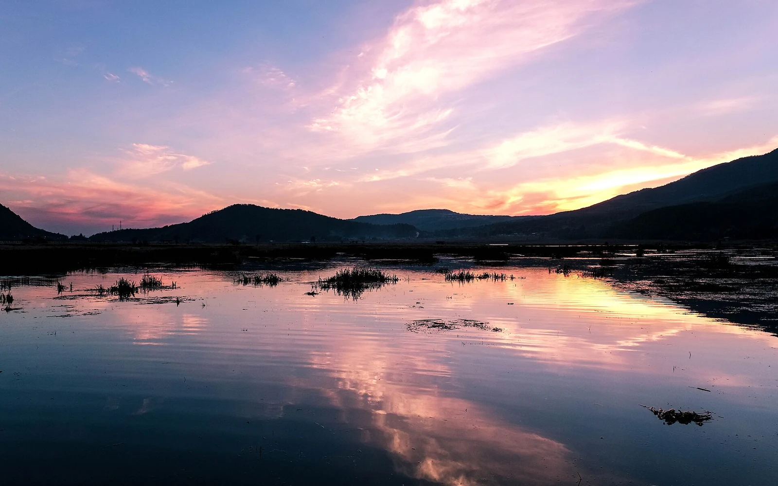 Sunset reflected in Beihai Wetland near Tengchong