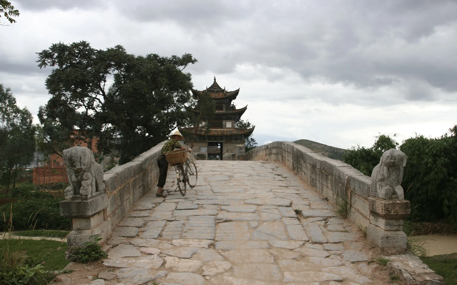 Stone walkway and pavilion on Shuanglong Bridge near Jianshui