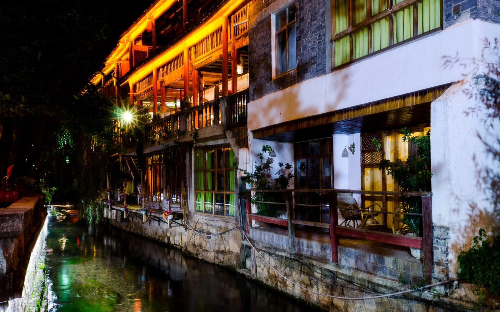 Evening reflections along a canal in Lijiang Old Town