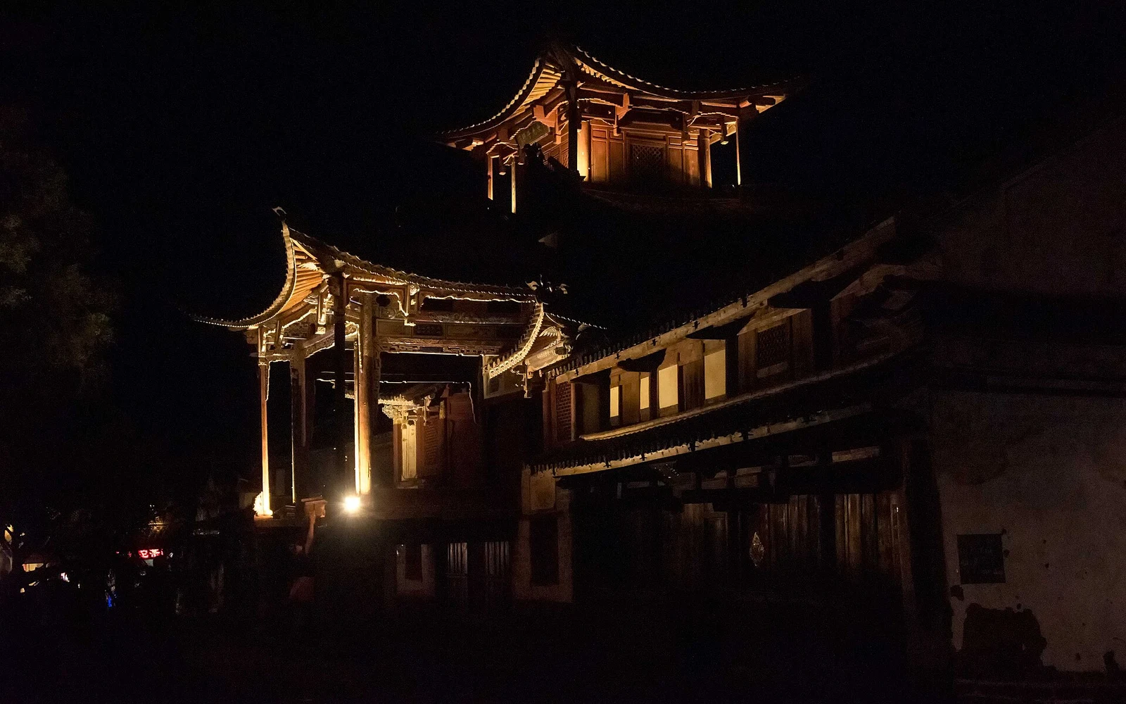 Illuminated historic theatre at Sideng Square in Shaxi