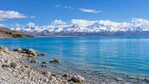 AI-generated illustration: namtso lakeshore and snow mountains.