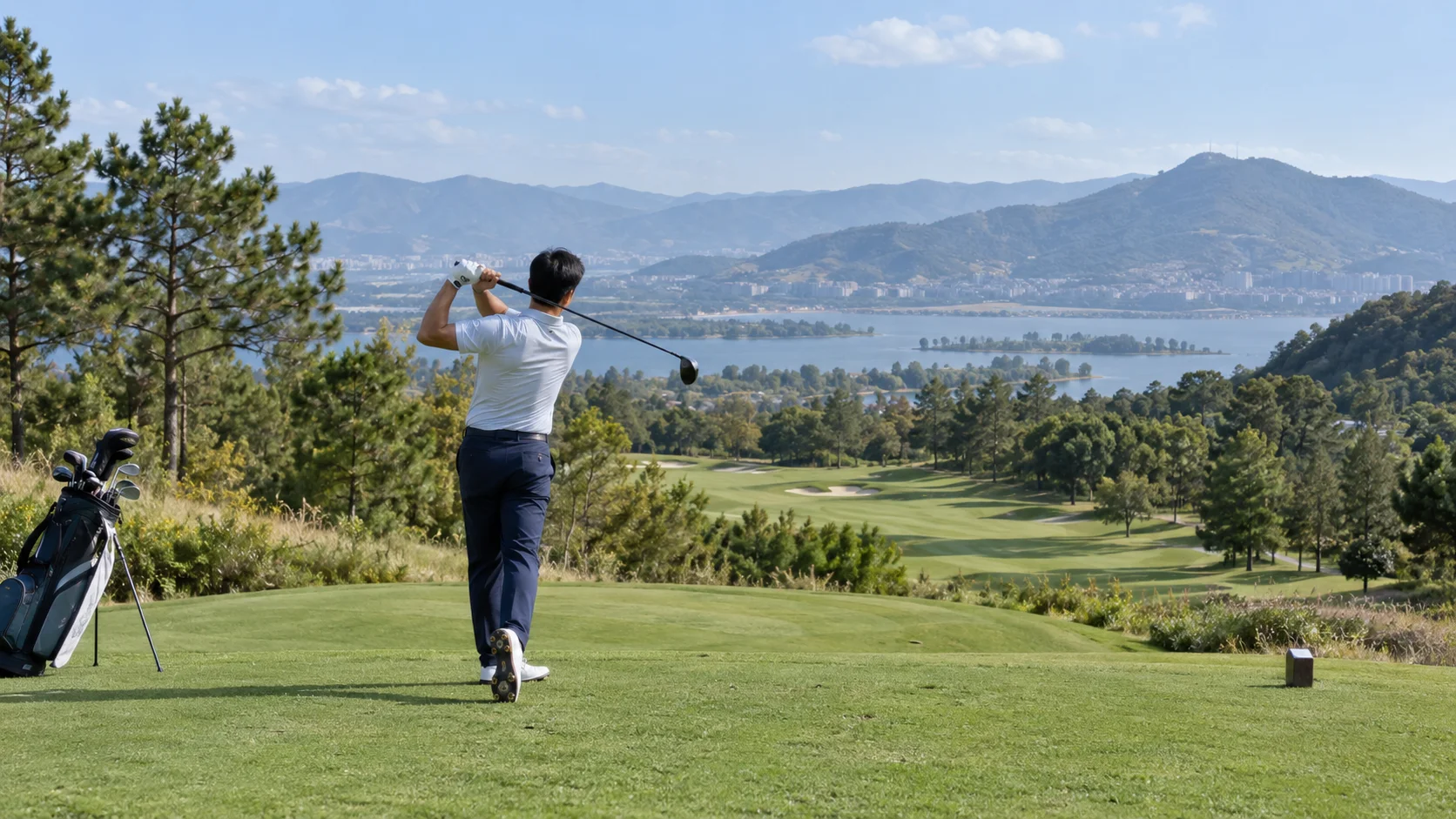 Illustration of a golfer finishing a tee shot on a highland course
