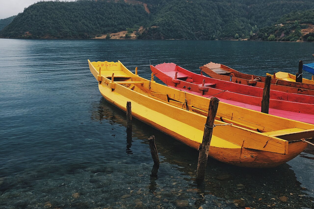 A lake boat trip is followed by the road connection to Lijiang and rail journey to Kunming.