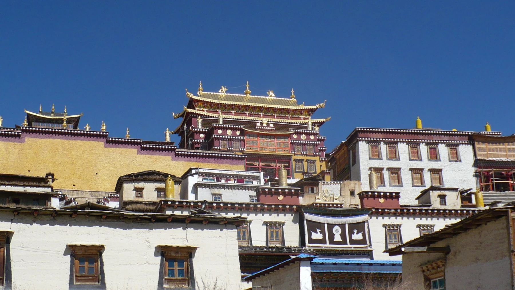 Golden roofs and temple buildings at Songzanlin Monastery in Shangri-La